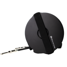 Load image into Gallery viewer, Image of the back of the Cabli cable management system showing the hand strap and 1/4&quot; connectors of cable.
